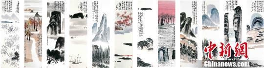 齐白石的鸿篇巨制《山水十二条屏》今日在北京亮相。 马海燕 摄